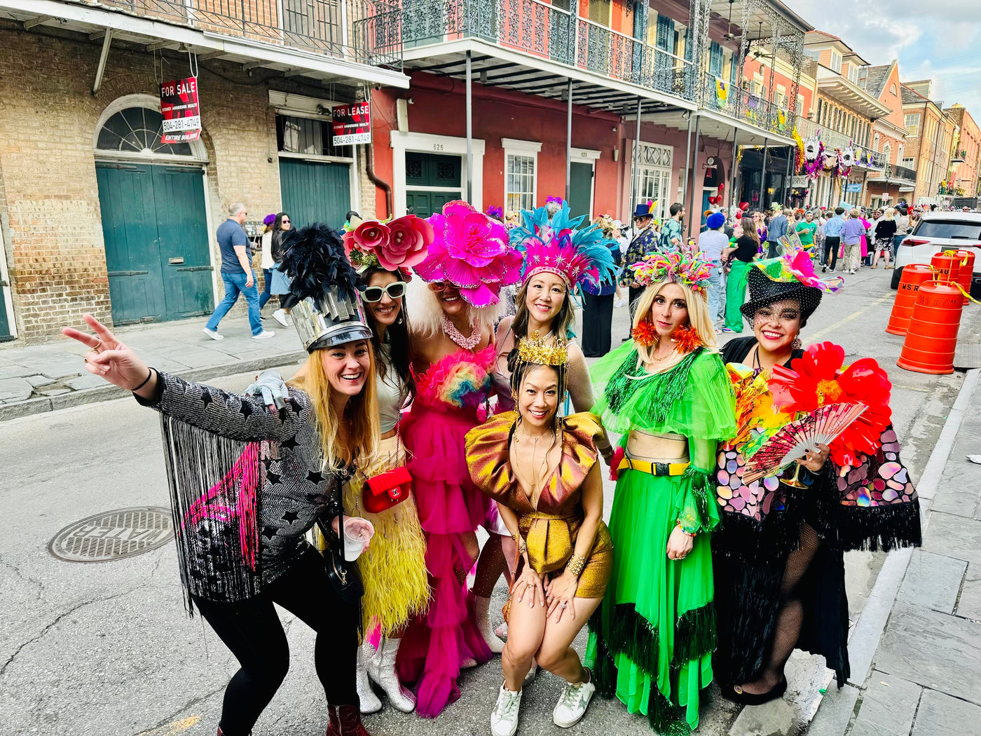 Group of friends in the French Quarter in costume during Mardi Gras