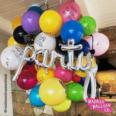 PARTY script silver balloon in a colorful balloon garland. Birthday decoration. Balloons by badassballoonco.
